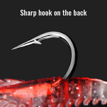 Load image into Gallery viewer, Metallic fishing hook on a red lure on a black background
